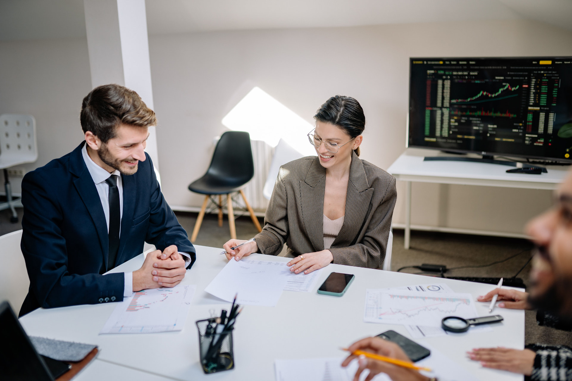 Professional advisors reviewing documentation in a meeting
